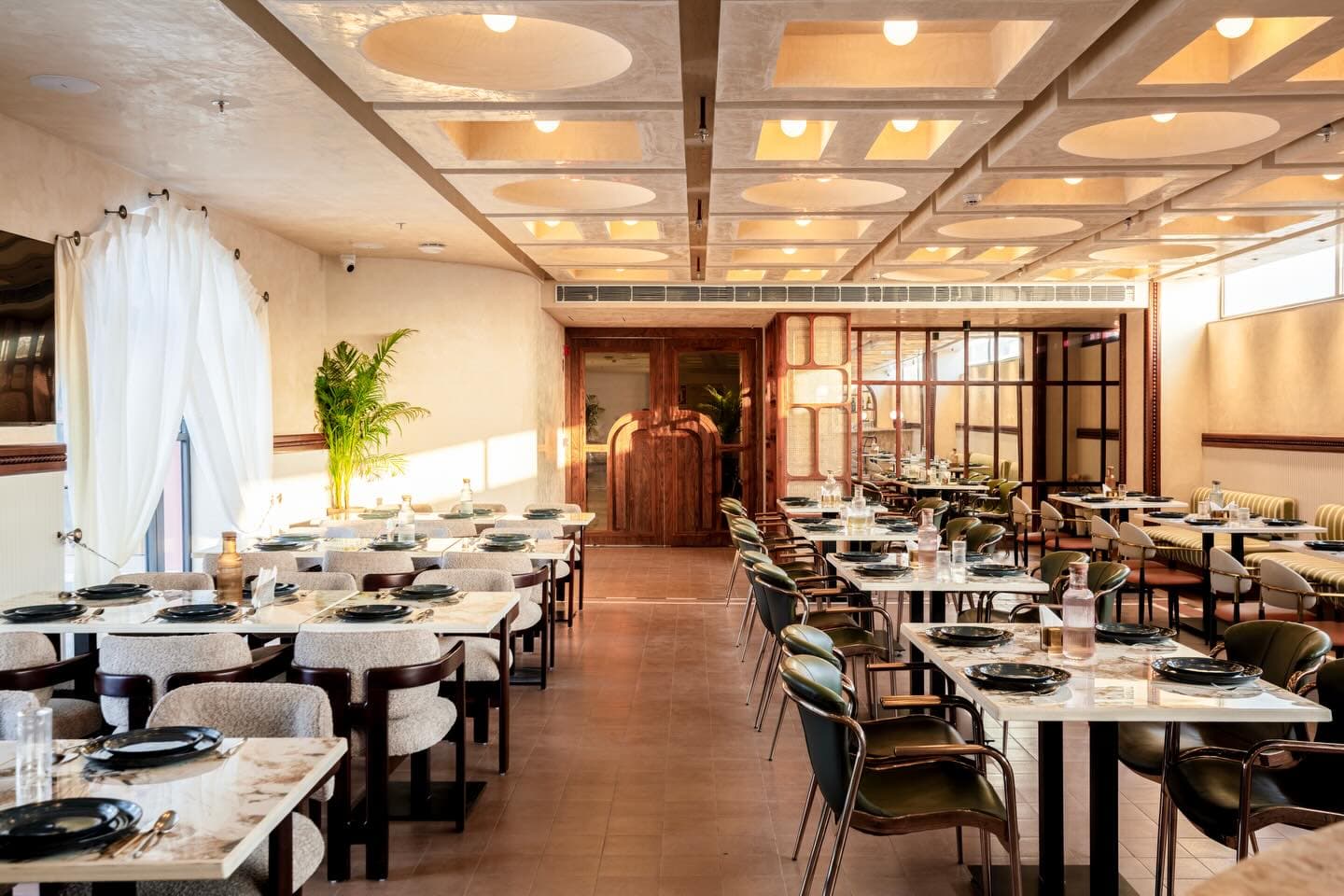 Restaurant at Clarks Safari — coffered ceiling and marble tables
